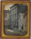 (URBAN STREET SCENE) A full-plate daguerreotype street scene featuring a staged tableau in which
